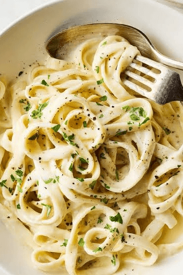 PASTA ALFREDO Fettuccine, Butter, And Parmigiano-Reggiano Cheese, Traditionally Emulsified with Starchy Pasta Water, Cooking Cream, Garlic, And Sometimes Pepper Or Nutmeg, Chicken, Shrimp, Parsley, Mozzarella.